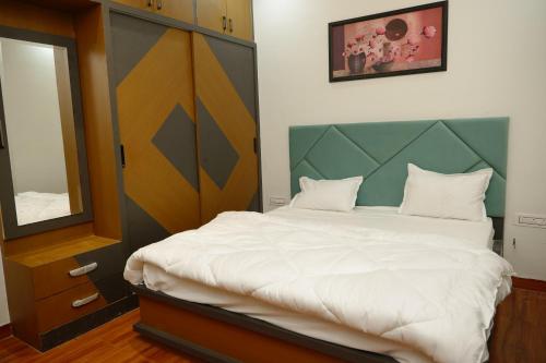 Ένα ή περισσότερα κρεβάτια σε δωμάτιο στο Hotel Panache The Escape - Home Stay