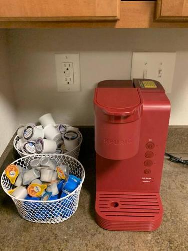 a red blender sitting next to a basket of cups at Good Vibe in the heart of Plaza/Midwood area in Charlotte