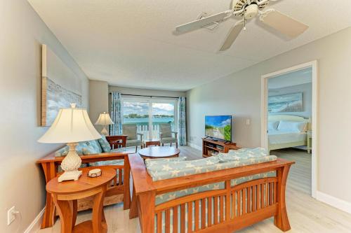 a living room with a couch and a table at Anna Maria Island Beach Palms 6B in Bradenton Beach