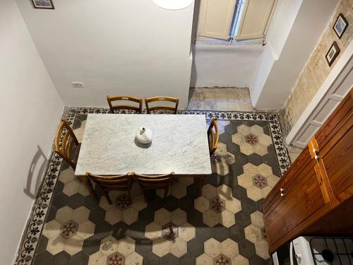 an overhead view of a dining room table and chairs at Valletta Period Townhouse in Valletta