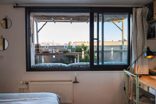 Photo de la galerie de l'établissement Appartement avec 2 terrasses et vues d'exception, à Paris