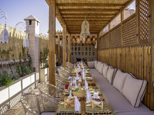 a long long table on an outdoor patio at Riad Almisk in Marrakech