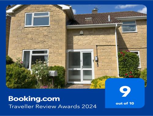 a house with a sign that says buyer review awards at Premium Deal l Hill View Home l Last-Minute Offer l Cheltenham l AJ Properties l Perfect for Short or Long Stays l 4Beds 4Bedrooms in Cheltenham