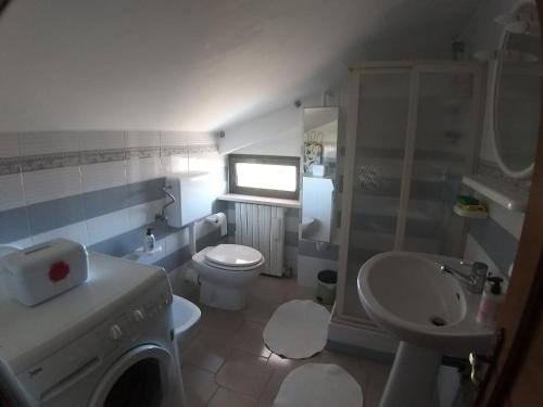 a bathroom with a sink and a toilet and a shower at La Finestra d'Abruzzo in Ortona