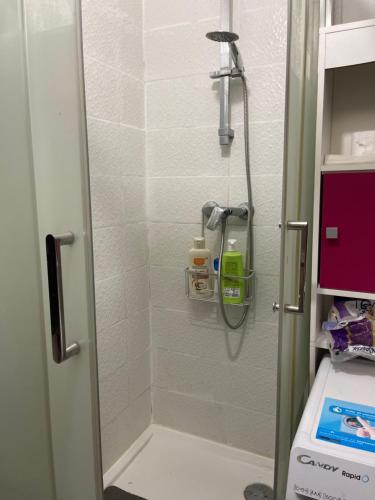 a shower in a bathroom with a glass door at chambre double std in Longjumeau