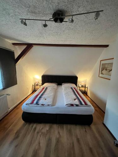 a bedroom with a bed in the middle of a room at Ferienwohnung Brockenblick in Wernigerode