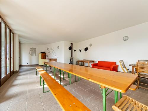 a living room with a long table and chairs at Rododendro House Relax in Germasino