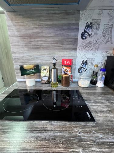 a kitchen counter with a stove top with ingredients on it at Cosy Apartment with Good Location Self Check In in Yerevan