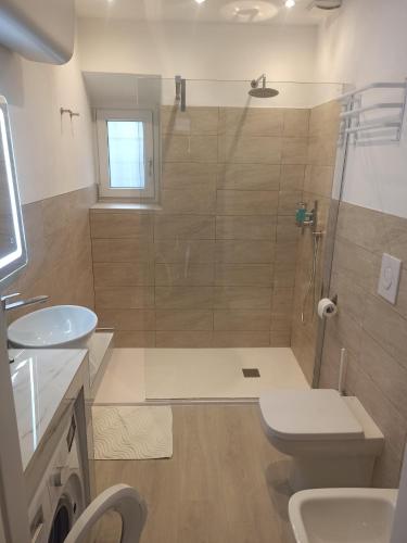 Koupelna v ubytování La Divina Suites
