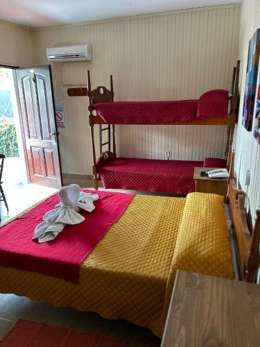 Cama o camas de una habitación en Apart Hotel Géminis