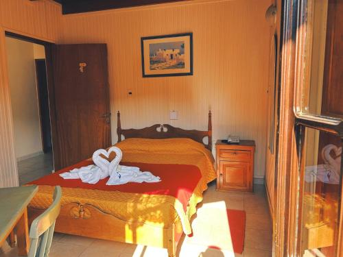 Cama o camas de una habitación en Apart Hotel Géminis