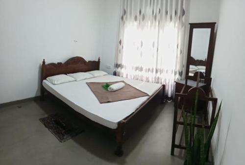 Ένα ή περισσότερα κρεβάτια σε δωμάτιο στο SINEJY HOLIDAY HOME