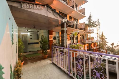 a balcony of a building with plants on it at Mirage Grand in McLeod Ganj