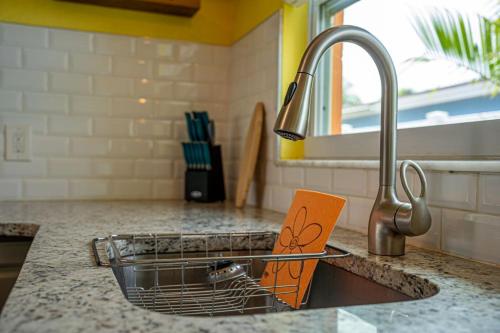 a kitchen sink with an orange card in it at Sunny Delight I in Cape Canaveral