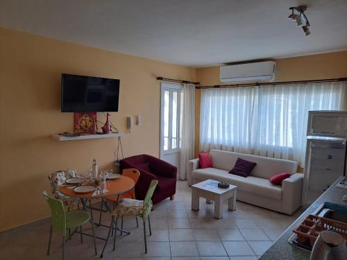 a living room with a couch and a table at Sunrise Beach Club (Hera B6@) in Kalecik