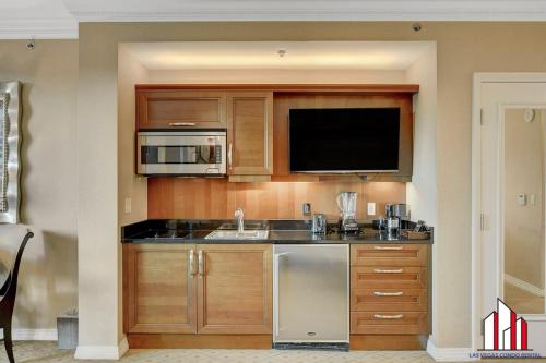 a kitchen with a sink and a microwave at MGM Signature-25-805 Balcony Strip Sphere F1 Views in Las Vegas