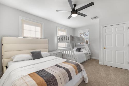 a bedroom with two beds and a bunk bed at 3-BR Getaway on the Chesapeake Bay in North Beach