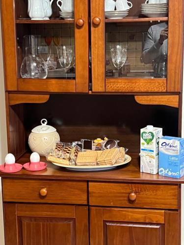 a plate of food sitting on top of a cabinet at Casa Belvedere Motta Camastra Gole Alcantara in Motta Camastra