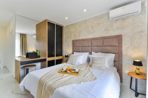 a bedroom with a bed with a tray of food on it at Holiday home in Bibinje with sea view, balcony, air conditioning, WiFi 5201-1 in Bibinje