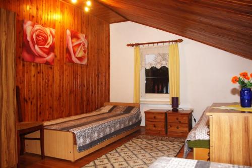 a bedroom with two beds and a window at Akacjowa 10 ROWY in Rowy