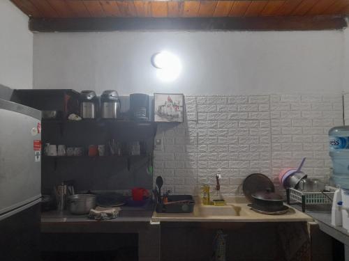 a kitchen with a sink and a counter top at La Nona in Puerto Iguazú