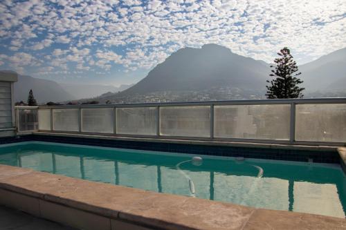 a swimming pool with a view of a mountain at Victoria Views in Cape Town