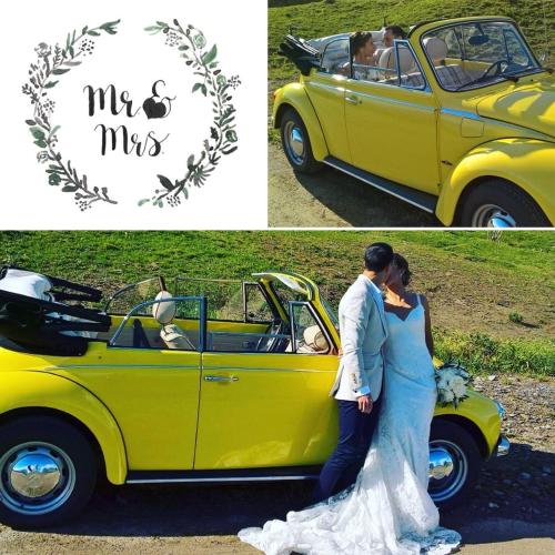 a bride and groom standing next to a yellow car at Wohnresidenz Casa Fortuna in Suhr