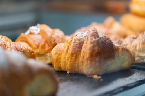 a bunch of pastries sitting on a table at Montecristo B&B in Grosseto