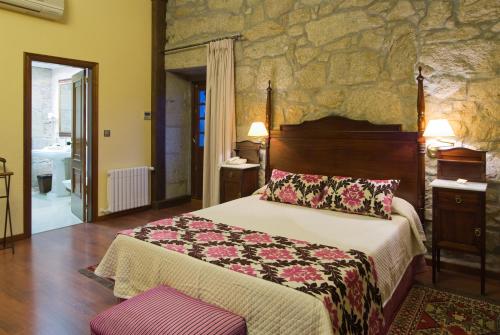 Postel nebo postele na pokoji v ubytování Hotel Pazo O Rial