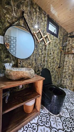 a bathroom with a sink and a mirror at Winhouse Villa in Hoi An