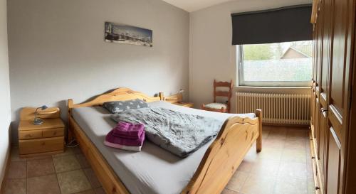 Llit o llits en una habitació de Ferienwohnung am Eschenberg