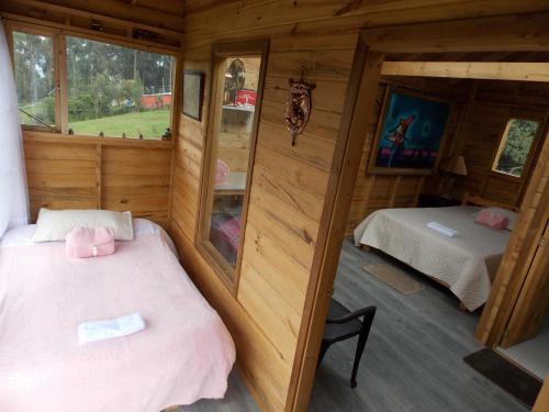 Ein Bett oder Betten in einem Zimmer der Unterkunft Posada Turistica Los Joseph