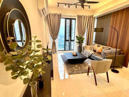 a living room with a couch and a table at SS KL Sentral by NomadNest in Kuala Lumpur