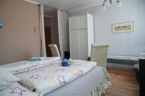 a bedroom with two beds with stars on it at Penzion Veronika in Štrba