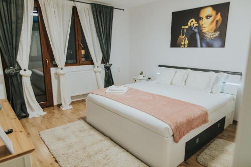 Postel nebo postele na pokoji v ubytování Kaius-Aparthotel