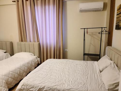 Cama ou camas em um quarto em Villa Elear
