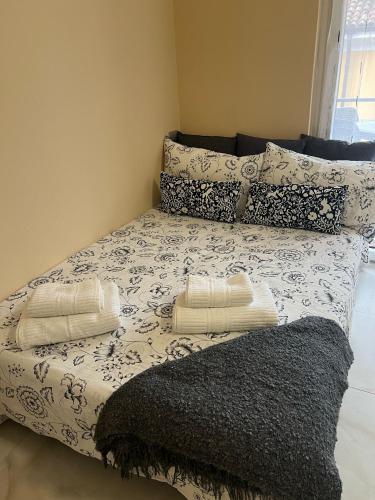 a bed with two pillows on top of it at casa Hanna2 in Intra
