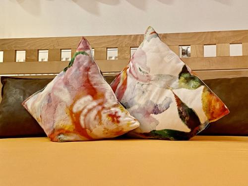 a couple of pillows sitting on a couch at Ferienhaus Alex in Wiesing