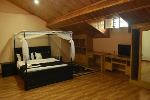 TV a/nebo společenská místnost v ubytování Ezeife Guesthouse