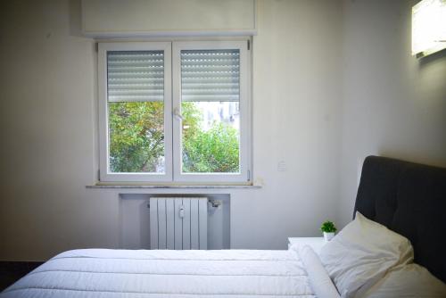 Ένα ή περισσότερα κρεβάτια σε δωμάτιο στο Luxhaven Venice