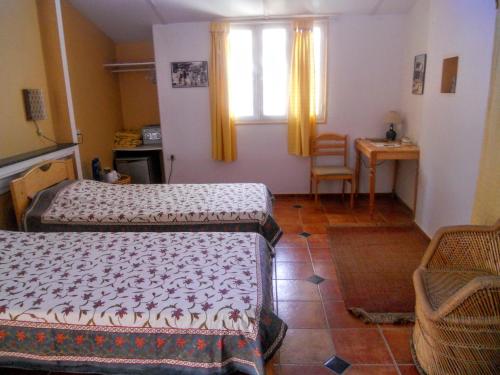 Un ou plusieurs lits dans un hébergement de l'établissement Casa Cottage