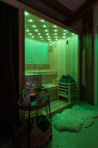 a room with a sauna with green lights on it at Masseria D'Achille in Castel di Sangro