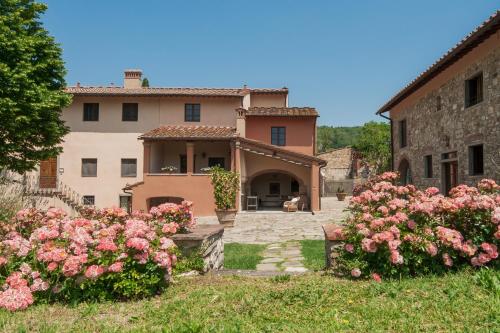 a garden filled with lots of flowers in front of a building at Borgo I Vicelli Country Relais in Bagno a Ripoli