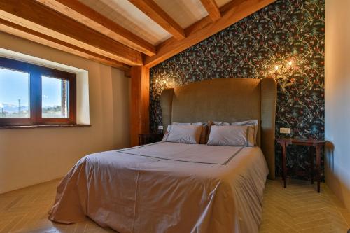 a bedroom with a bed in a room at Masseria D'Achille in Castel di Sangro