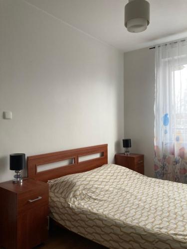 Posteľ alebo postele v izbe v ubytovaní Apartament Argo