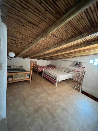 Postel nebo postele na pokoji v ubytování Mi casita de Los Andes Cabaña Familiar Apartaderos Merida