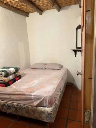 Postel nebo postele na pokoji v ubytování Mi casita de Los Andes Cabaña Familiar Apartaderos Merida
