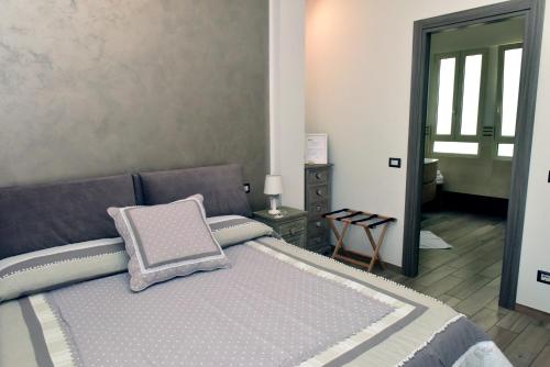 a bedroom with a bed with a pillow on it at In Terrazza Da Giusy in Rome