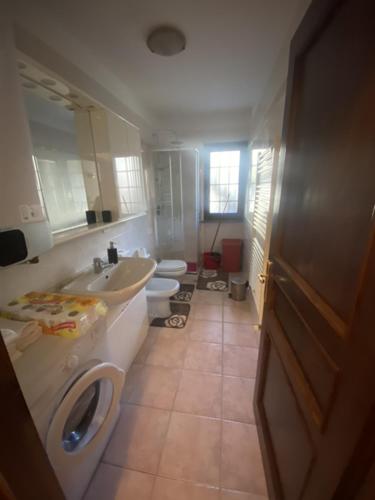 a bathroom with a sink and a toilet at APPARTAMENTO MORGEX in Morgex