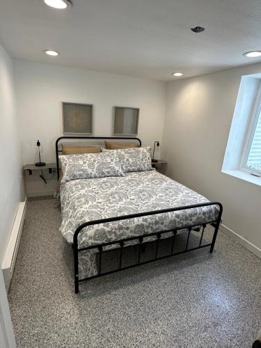 a bedroom with a bed in a room at Basement Bliss: Cozy Getaway in Cheyenne